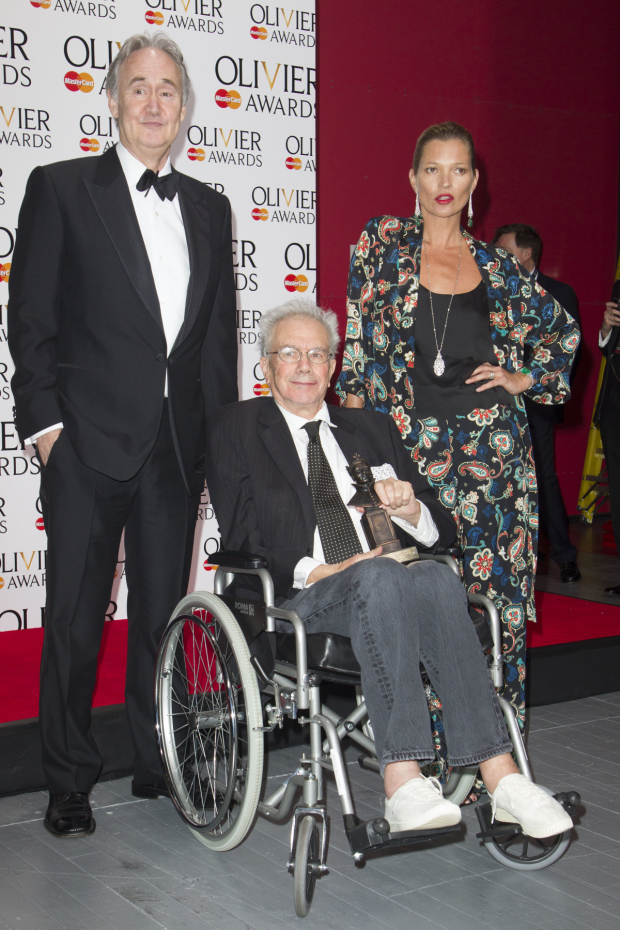 Michael White picking up an Olivier Award in 2014 with Nigel Planer and Kate Moss