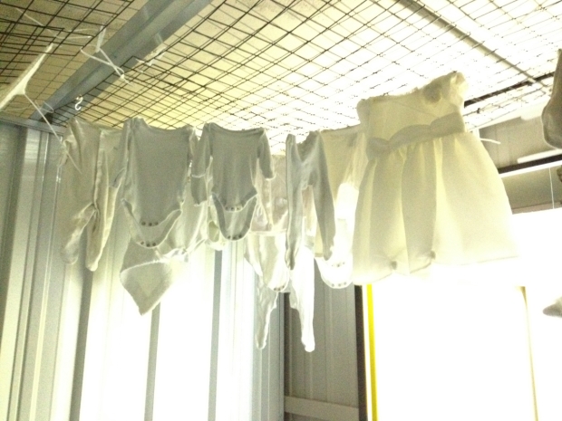 Baby clothes in the set of Handle with Care