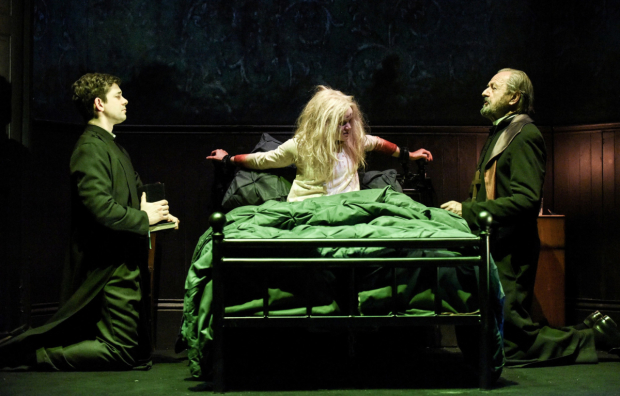Adam Garcia as Father Damien Karras, Clare Louise Connolly as Regan and Peter Bowles as Father Merrin in The Exorcist