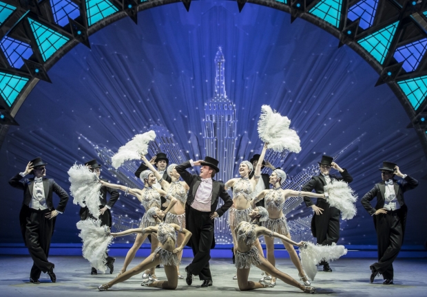 Haydn Oakley, centre, with the cast of An American in Paris
