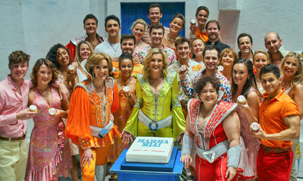The current cast of Mamma Mia! celebrating the show&#39;s birthday 