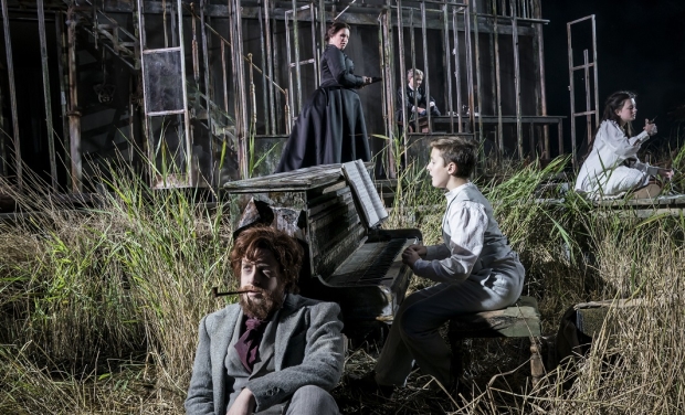 Elgan Llŷr Thomas (foreground) as Peter Quint, Daniel Alexander Sidhom as Miles, Anita Watson as the Governess, Janis Kelly (background) as Mrs Grose and Elen Willmer as Flora in The Turn of the Screw (ENO/Open Air Theatre)