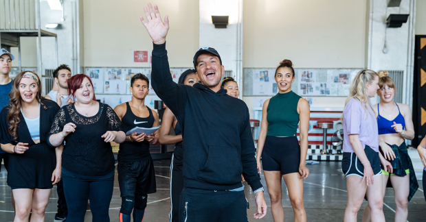 Peter Andre and ensemble rehearsing for Grease