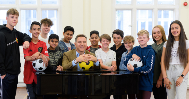 David Walliams with the child cast of The Boy in the Dress