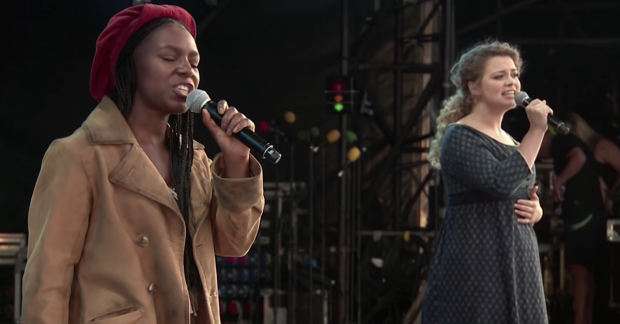 Shan Ako and Carrie Hope Fletcher performing on stage