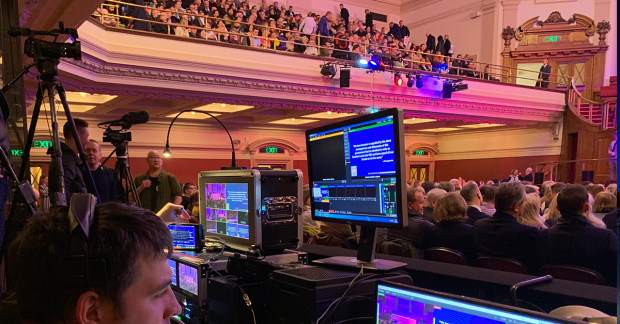 An auditorium in action with live-streamed equipment 