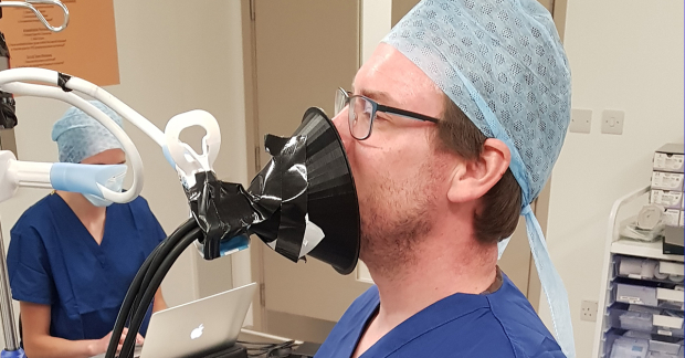 Scientific experiment to measure the spread of aerosols emitted when singing is conducted in an orthopaedic operating theatre, an environment of &quot;zero aerosol background&quot;