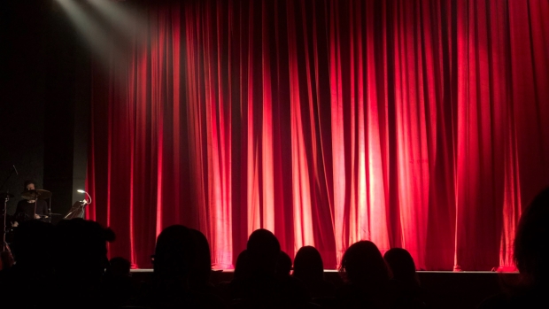 A red curtain in an auditorium