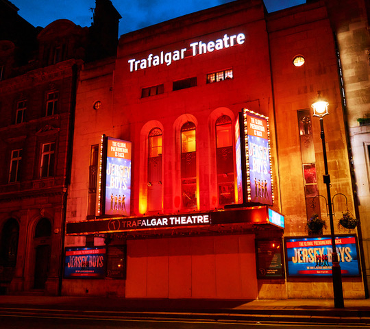 Trafalgar Theatre illuminated red