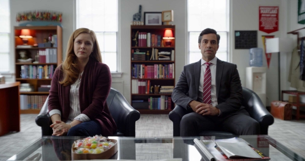 Cynthia Murphy (Amy Adams) and Larry Mora (Danny Pino) 