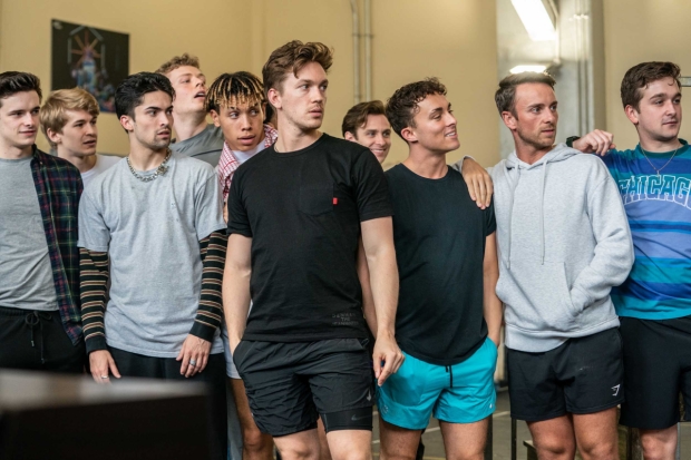 Dan Partridge (centre) and the company of Grease