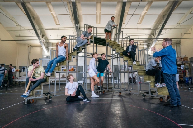 Director Nikolai Foster (bottom right) and the company of Grease