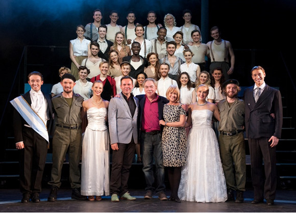 Andrew Lloyd Webber with the cast of Evita