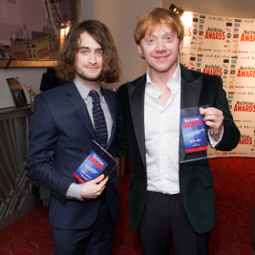 Daniel Radcliffe and Rupert Grint celebrating their award wins